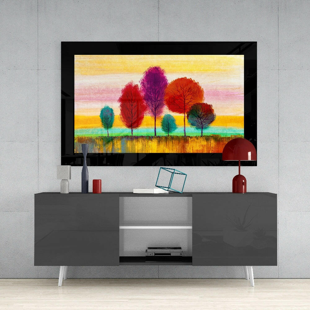 Pastel Trees glass wall art styled above a sideboard in a reading nook