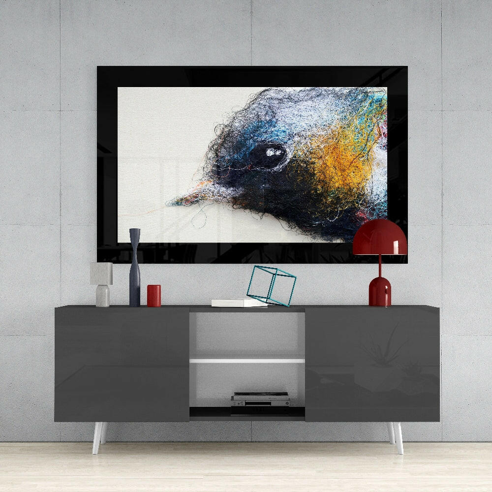 Cute Bird glass wall art styled above a sideboard in a creative studio