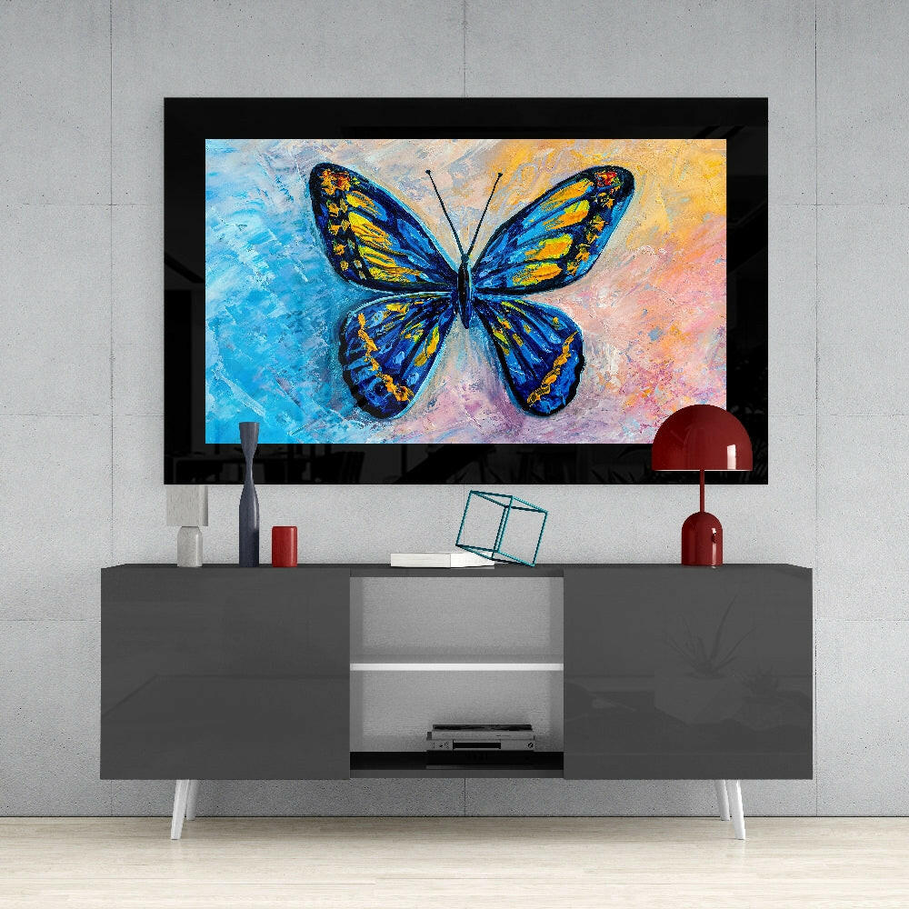 Colorful Butterfly glass wall art styled above a console in a sunroom