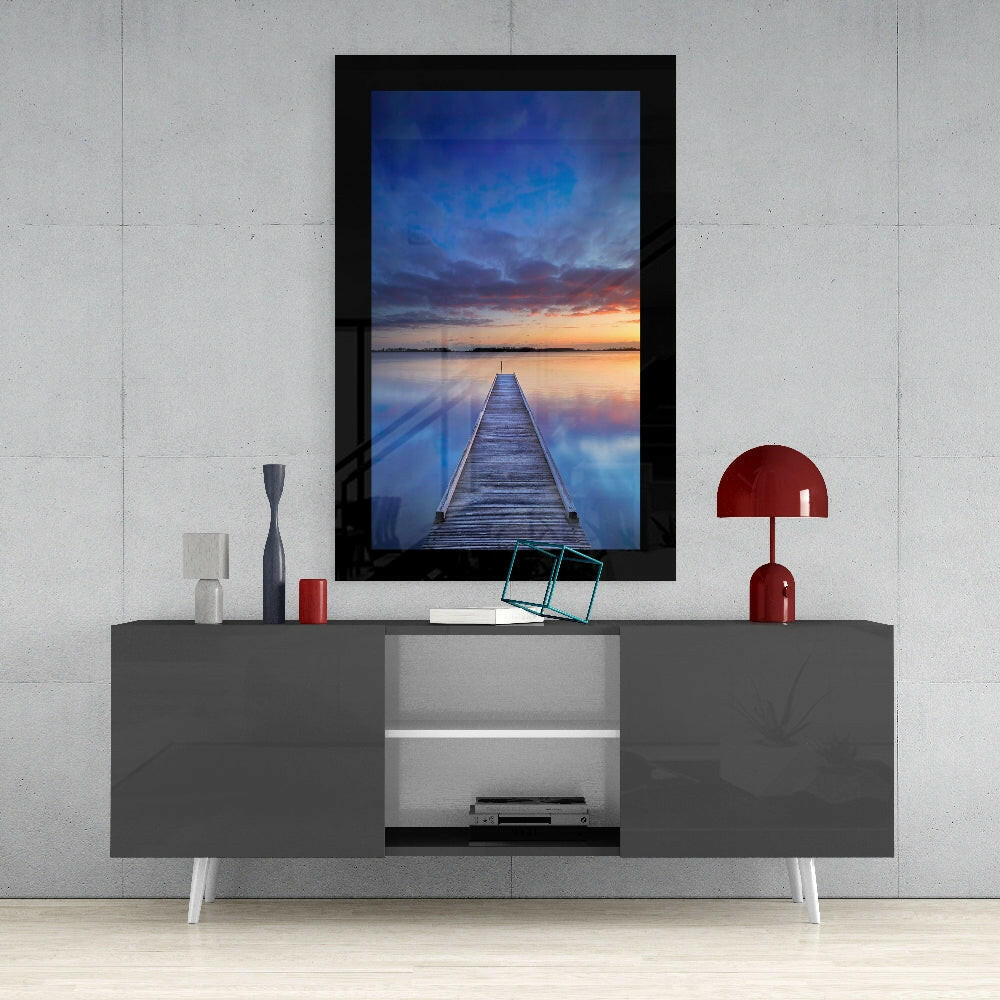 Sunset on the Dock glass wall art styled above a console in a meditation room