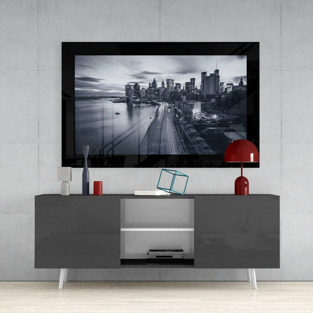 New York glass wall art styled above a console in a media room