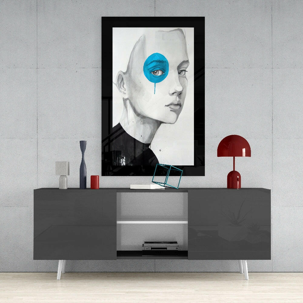 Blue Vision glass wall art styled above a console in a reading nook