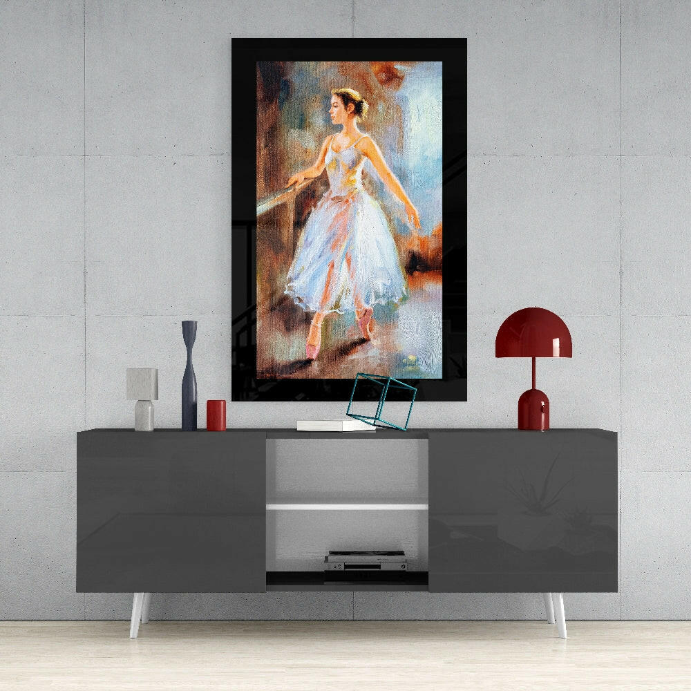 Ballerina glass wall art styled above a console in a reading nook