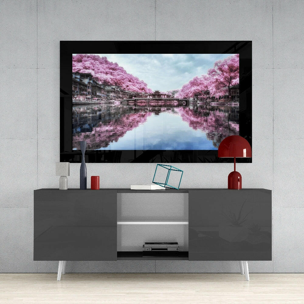 Sakura Trees glass wall art styled above a console in a reading nook