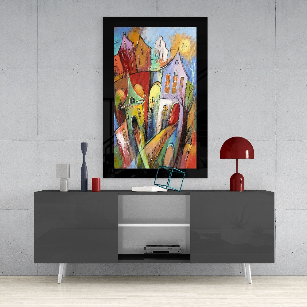 Houses glass wall art styled above a sideboard in a foyer