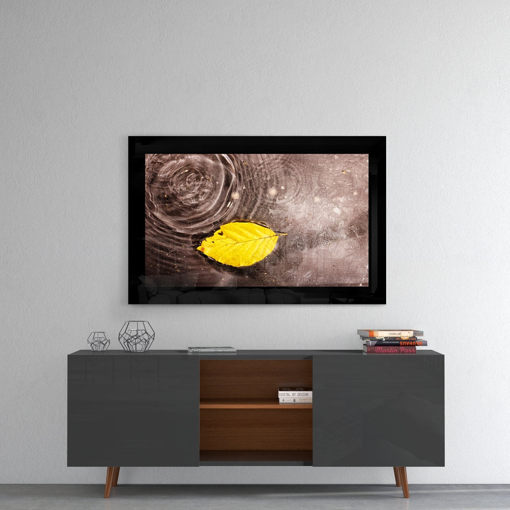 Autumn glass wall art styled above a console in a reading nook