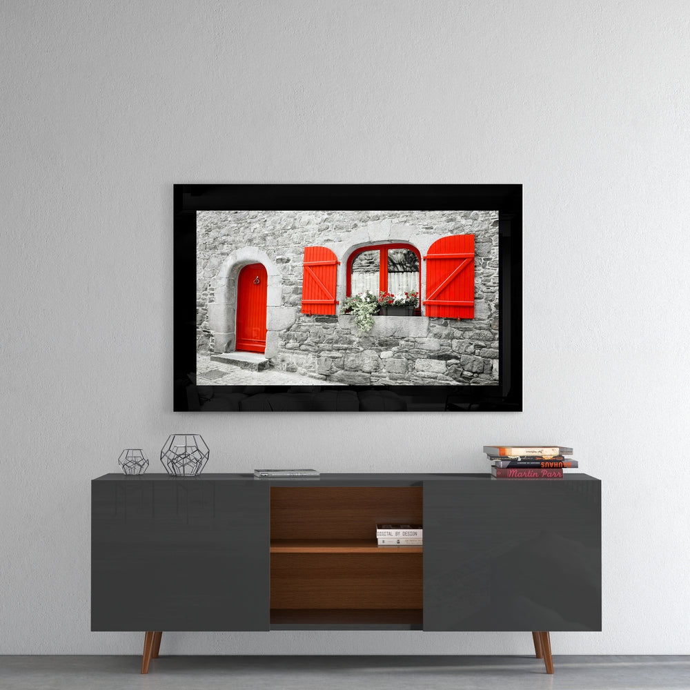 Red Entrance glass wall art styled above a sideboard in a reading nook