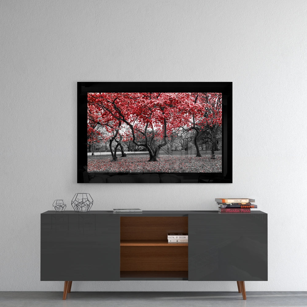 Red Trees glass wall art styled above a console in a meditation room