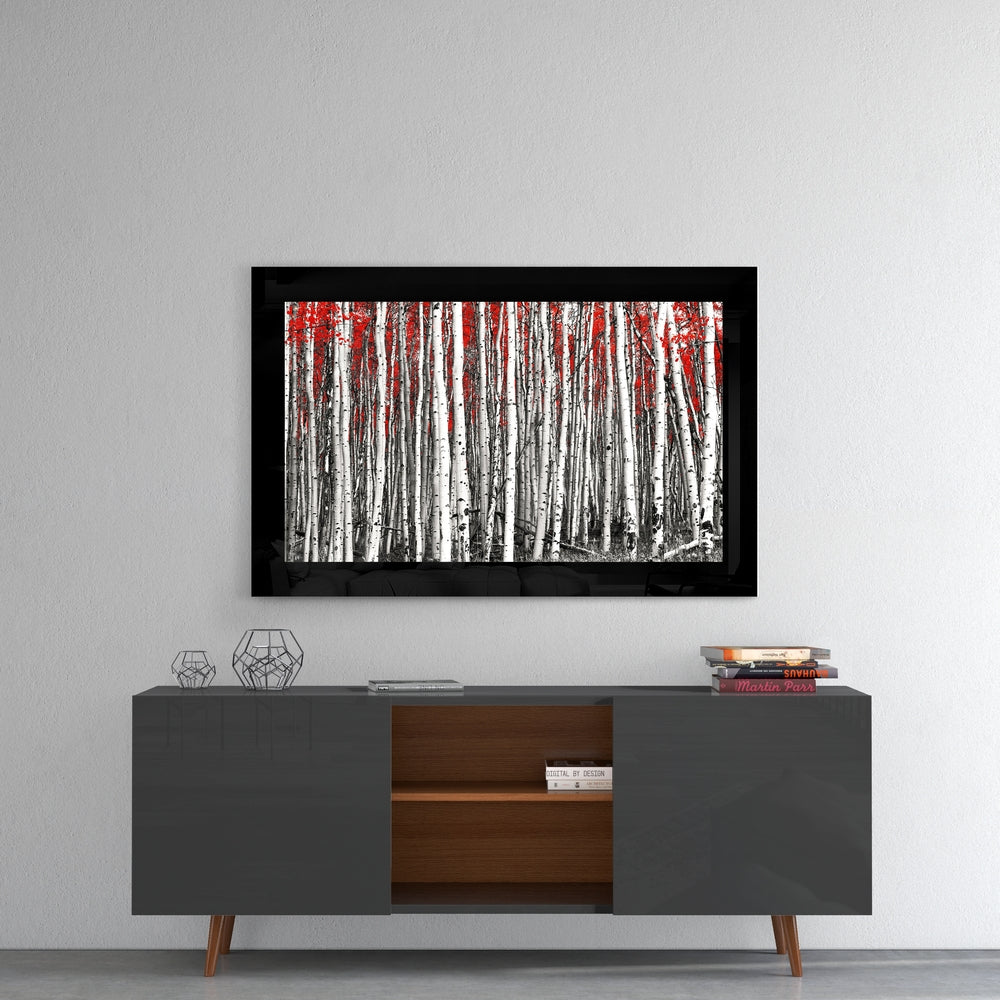 Red Forest glass wall art styled above a console in a meditation room