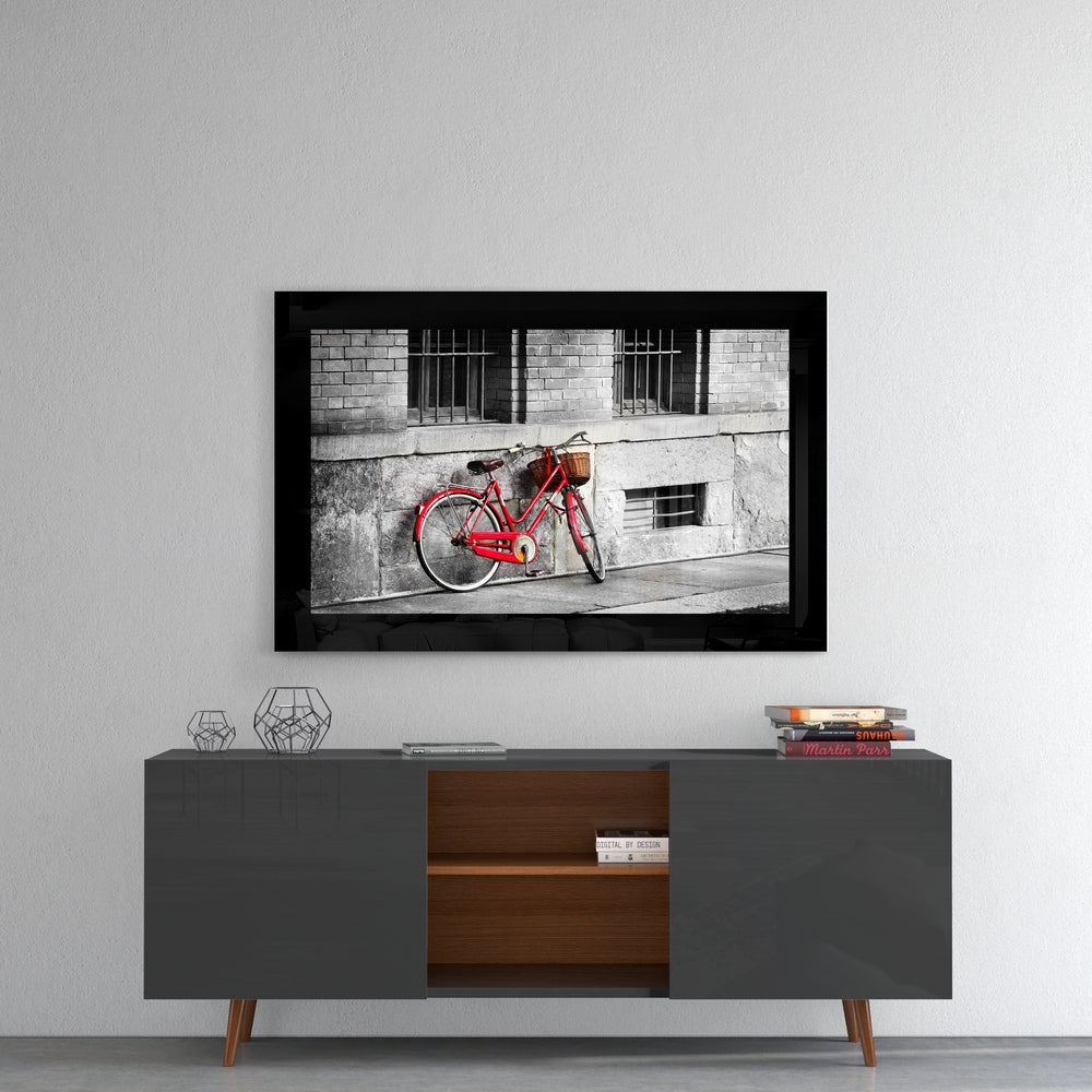 Red Bike glass wall art styled above a sideboard in a study