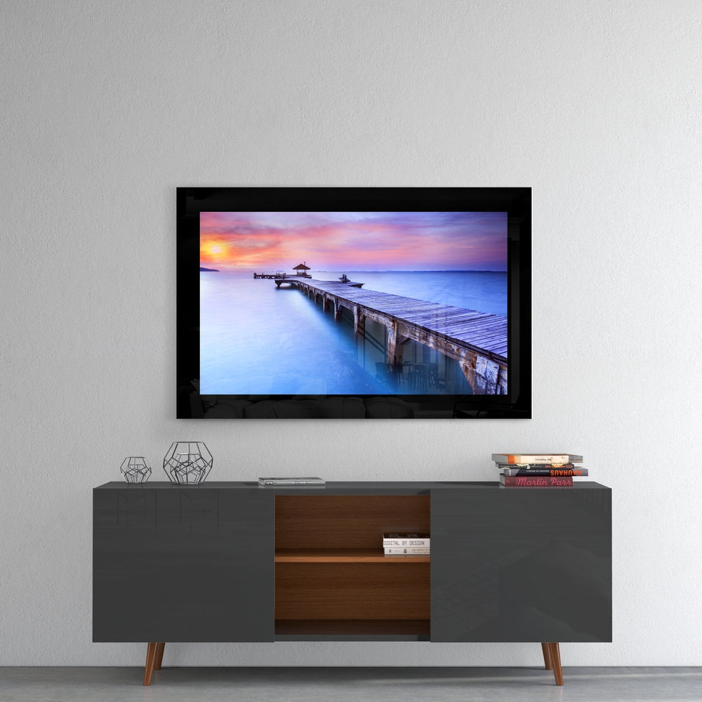 Sunset at the Pier glass wall art styled above a console in a meditation room