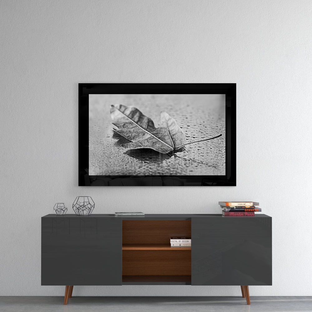 Leaf glass wall art styled above a console in a reading nook