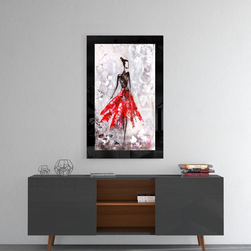 Ballerina glass wall art styled above a console in a reading nook