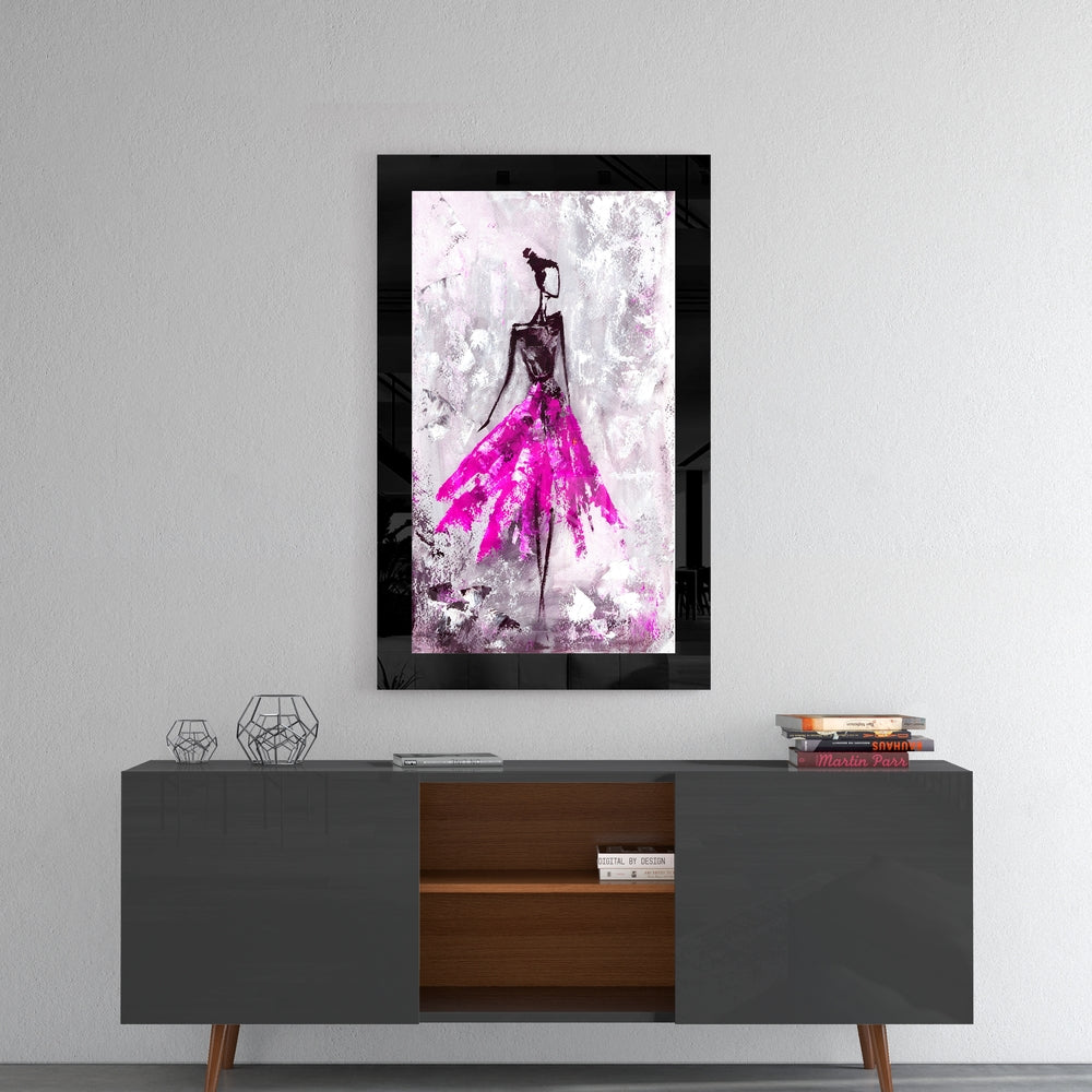 Ballerina glass wall art styled above a console in a reading nook