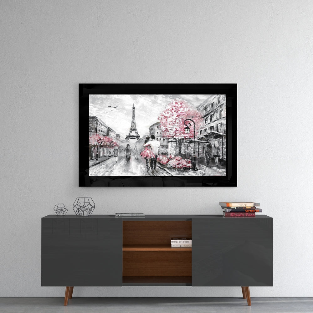 Pink and Paris glass wall art styled above a console in a reading nook