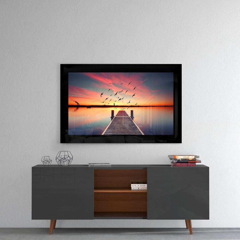 Sunset glass wall art styled above a console in a meditation room