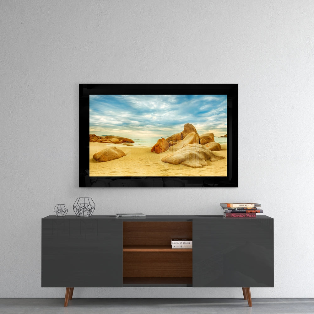 Sand and Rocks glass wall art styled above a console in a coastal cottage