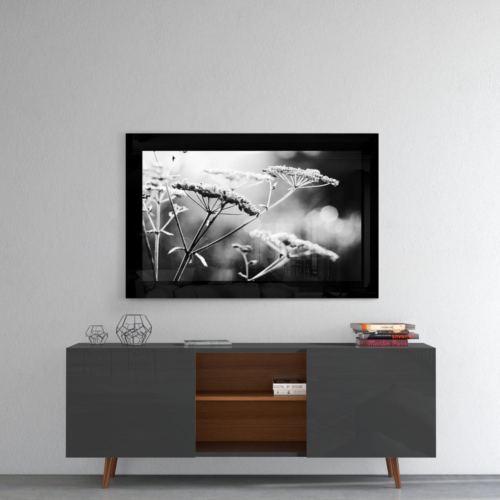 Bloom glass wall art styled above a console in a reading nook