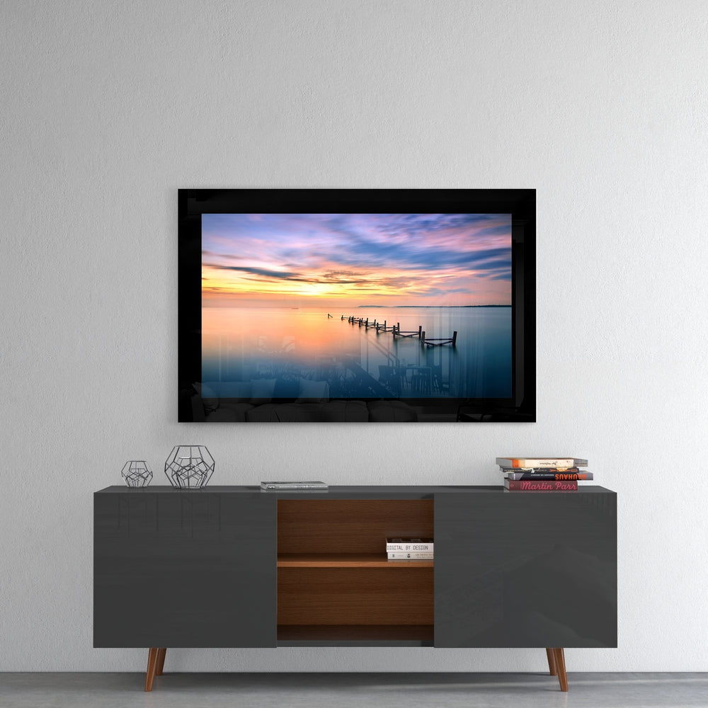 Sunset glass wall art styled above a console in a meditation room