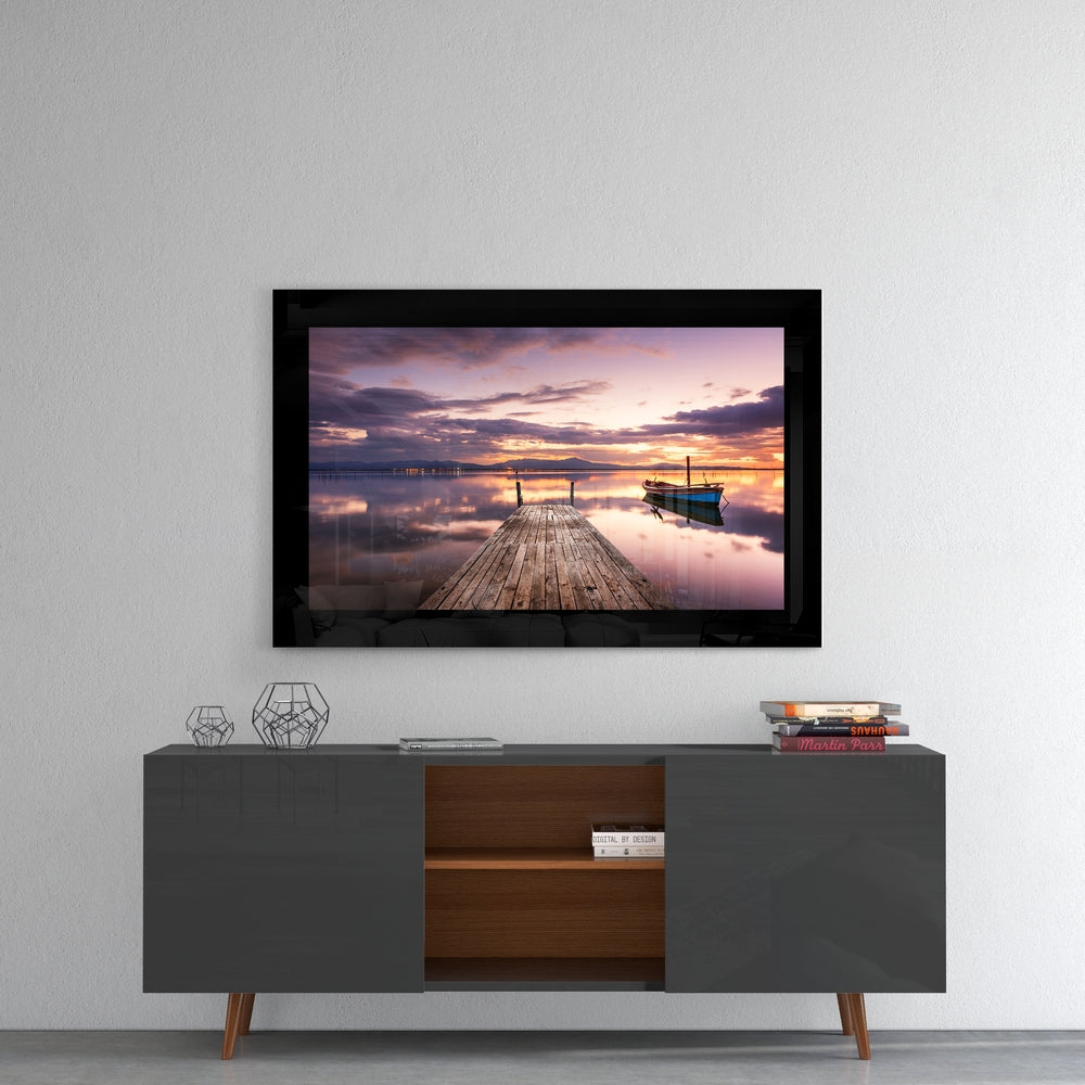 Sunset glass wall art styled above a console in a meditation room