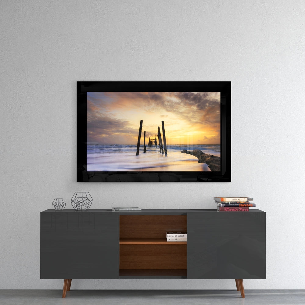 Sunset glass wall art styled above a console in a man cave