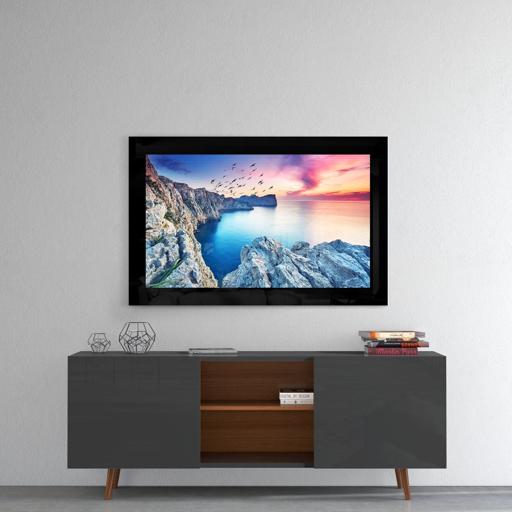 Birds and Reefs glass wall art styled above a console in a meditation room