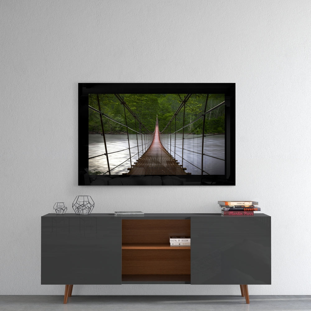 Forest Bridge glass wall art styled above a console in a reading nook