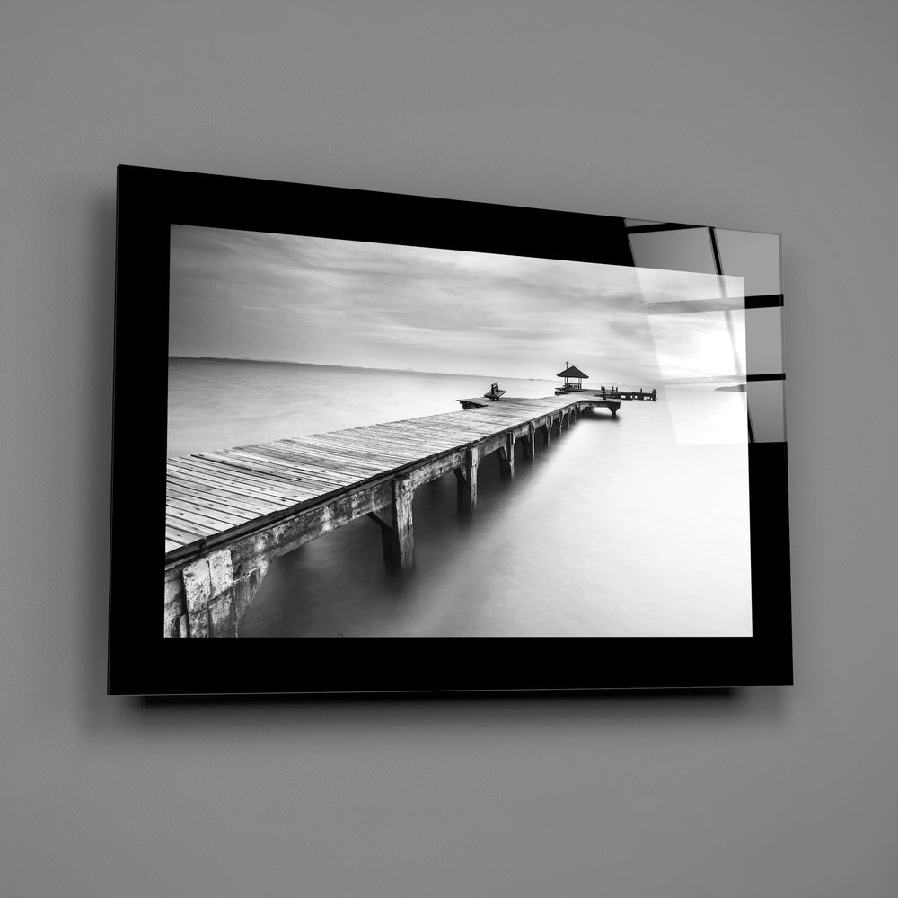 Editorial-photo panel bringing monochrome calm to a coastal cottage
