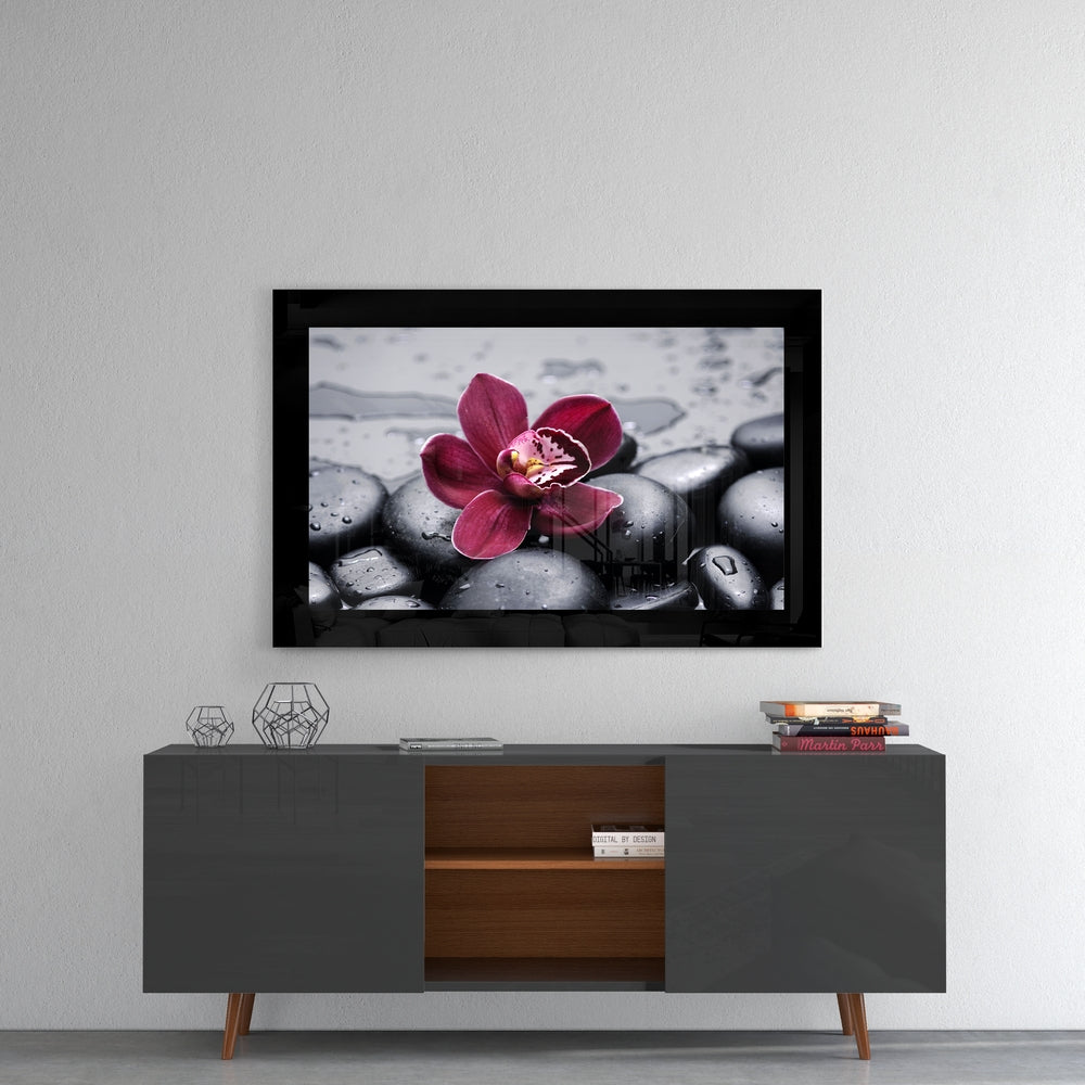 Orchid glass wall art styled above a console in a bedroom