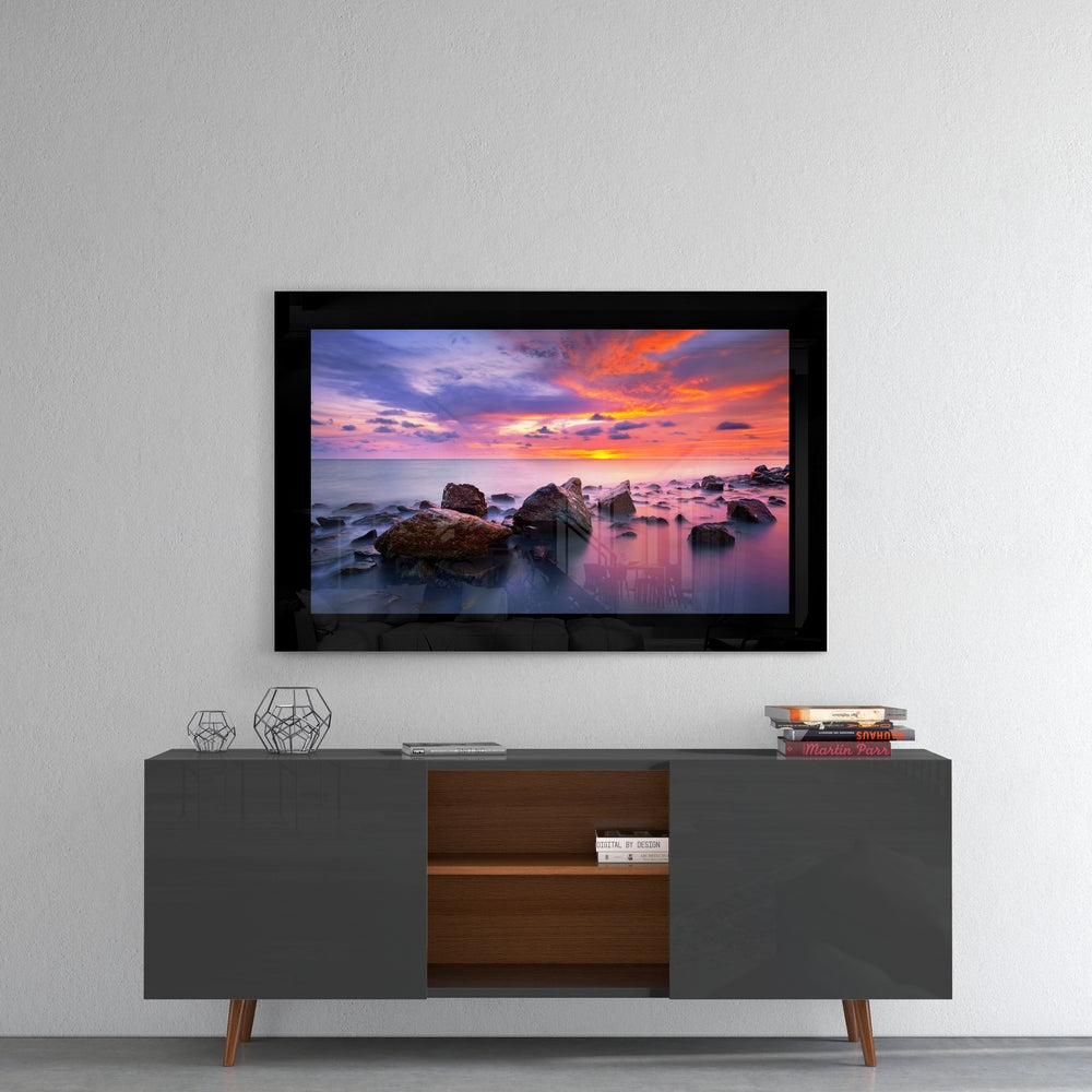 Sunset glass wall art styled above a console in a meditation room