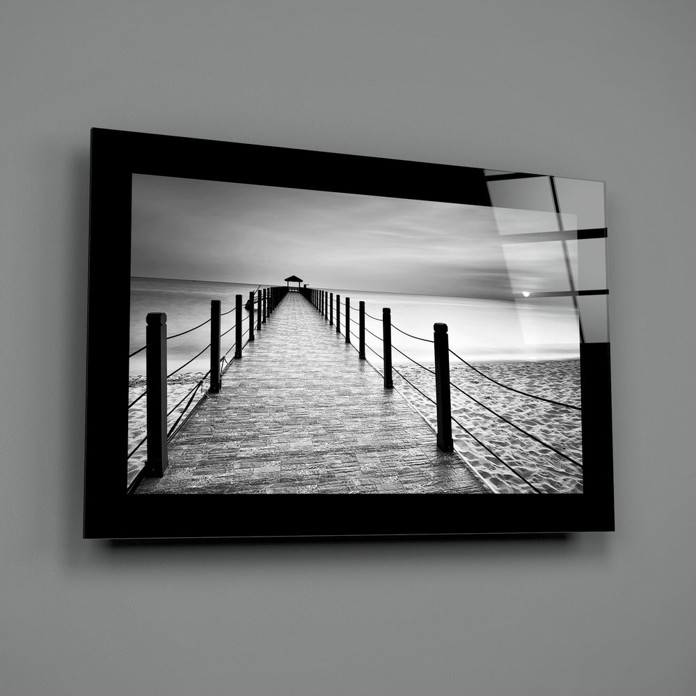 Editorial-photo panel bringing monochrome calm to a coastal cottage