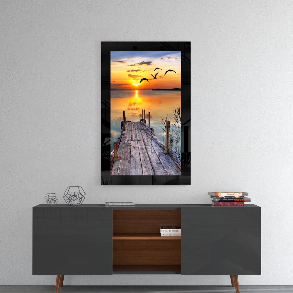 Sunset and the Birds glass wall art styled above a console in a meditation room