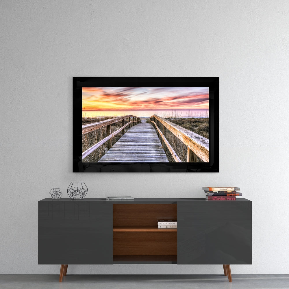 Sunset glass wall art styled above a console in a meditation room