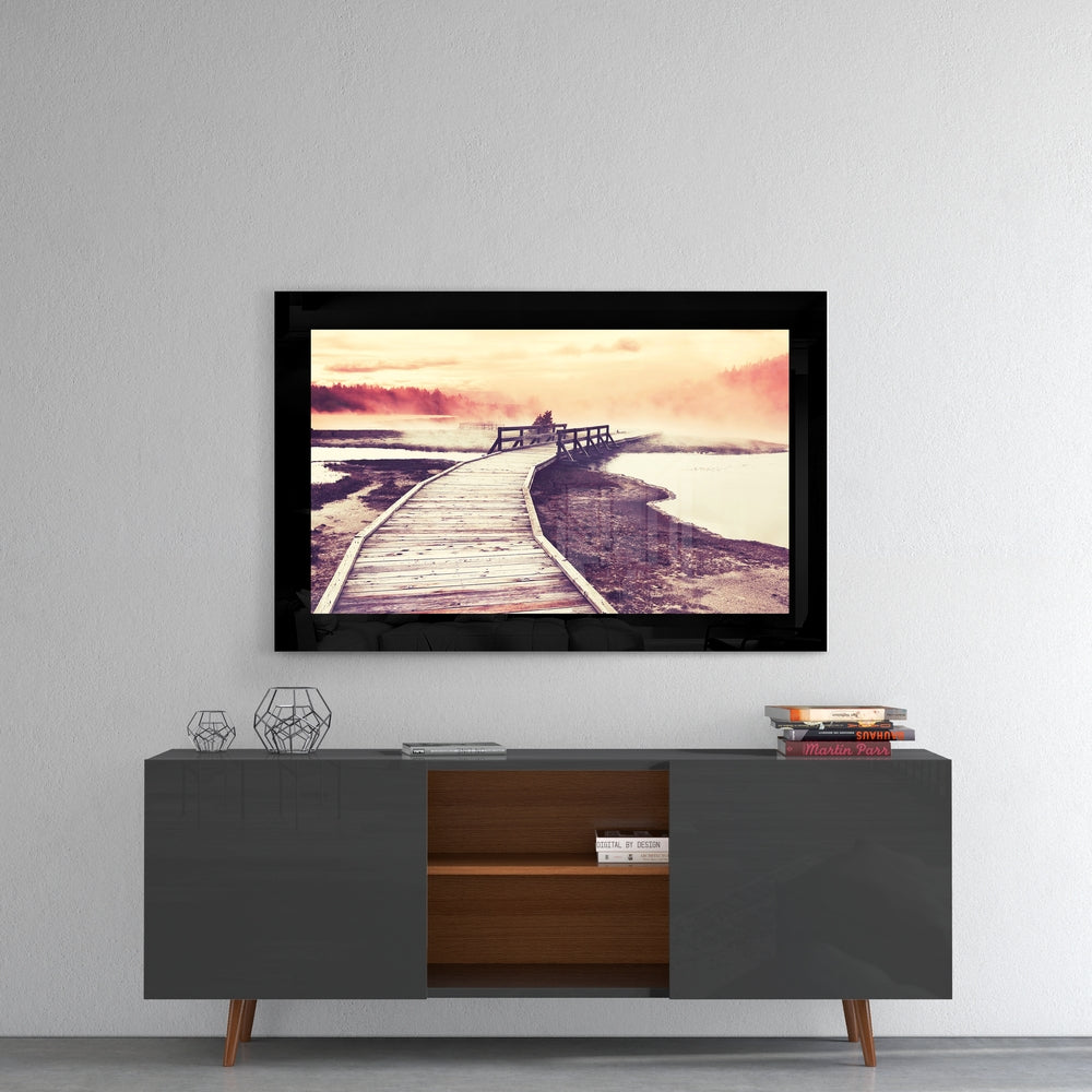 Sunset glass wall art styled above a console in a reading nook