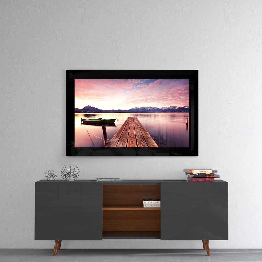 Sunset glass wall art styled above a console in a meditation room