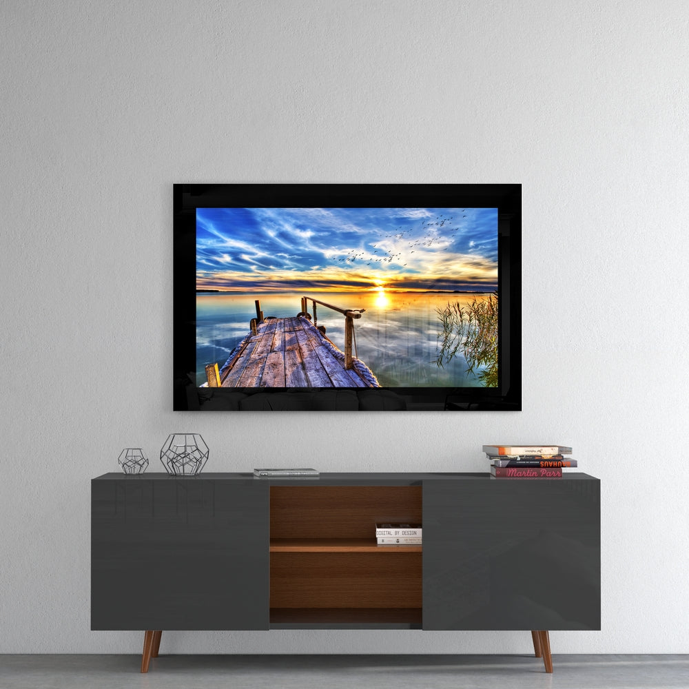 Sunset at Pier glass wall art styled above a console in a meditation room