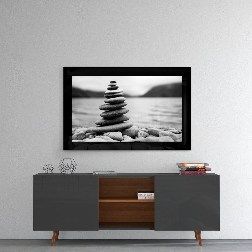 Balance glass wall art styled above a sideboard in a bedroom