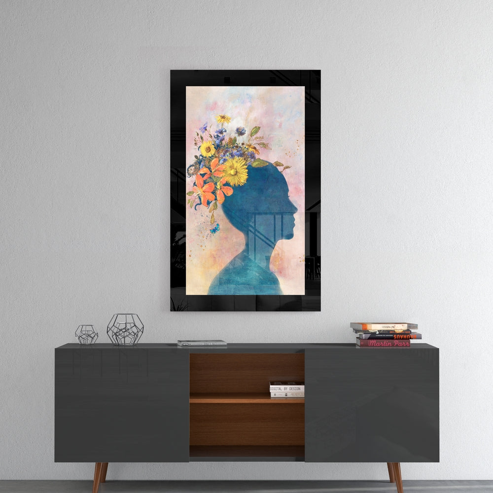Flowery Thoughts glass wall art styled above a console in a creative studio