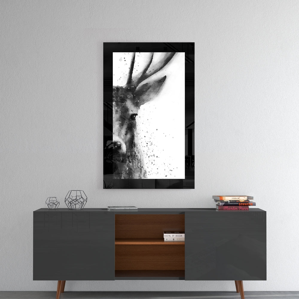Deer glass wall art styled above a console in a reading nook