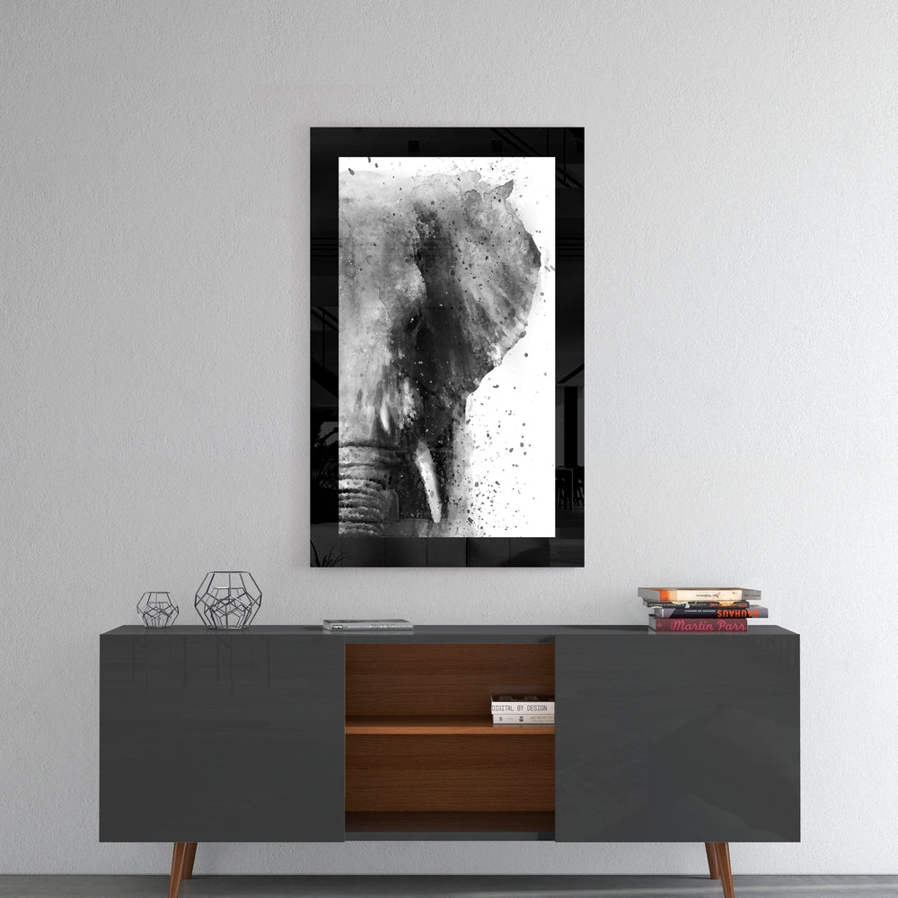 Elephant glass wall art styled above a console in a reading nook