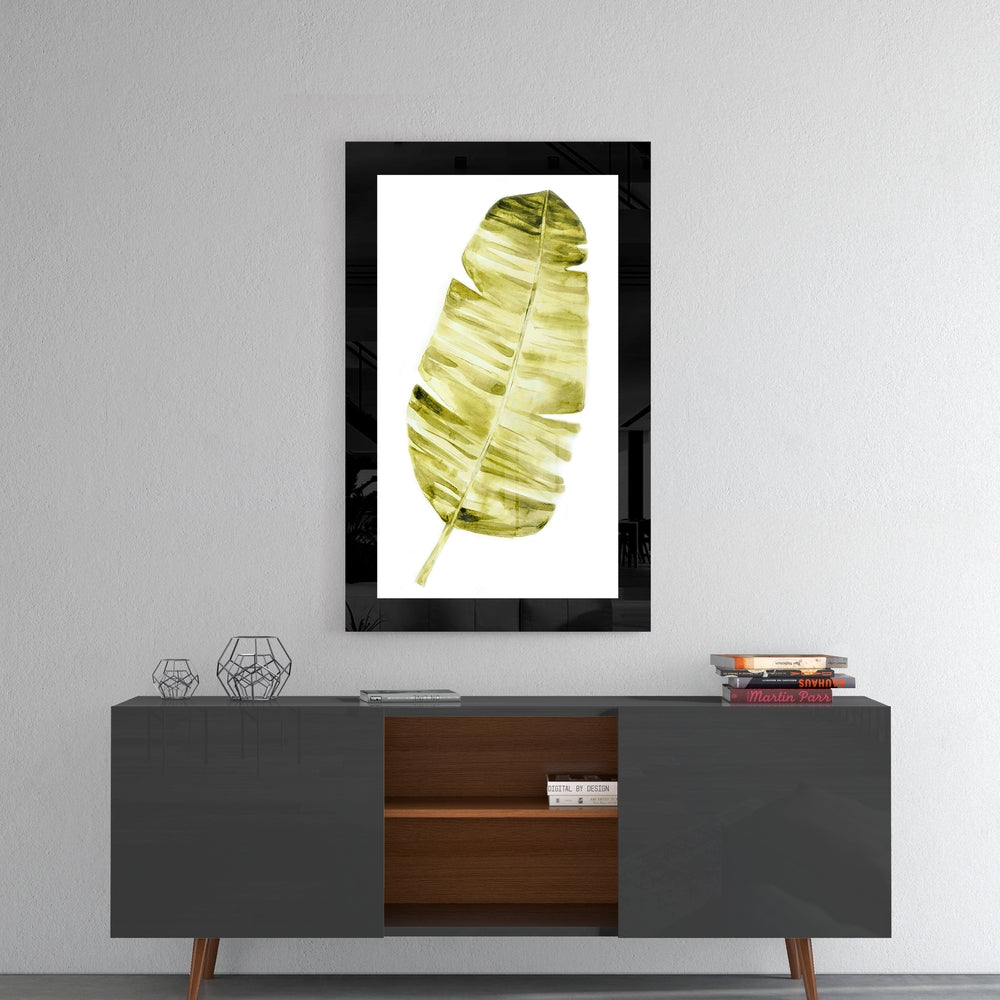 Leaf glass wall art styled above a console in a reading nook