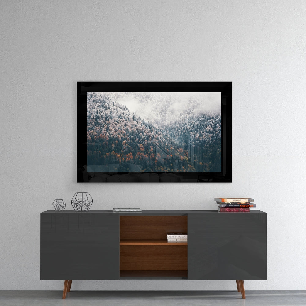 Forest glass wall art styled above a console in a reading nook
