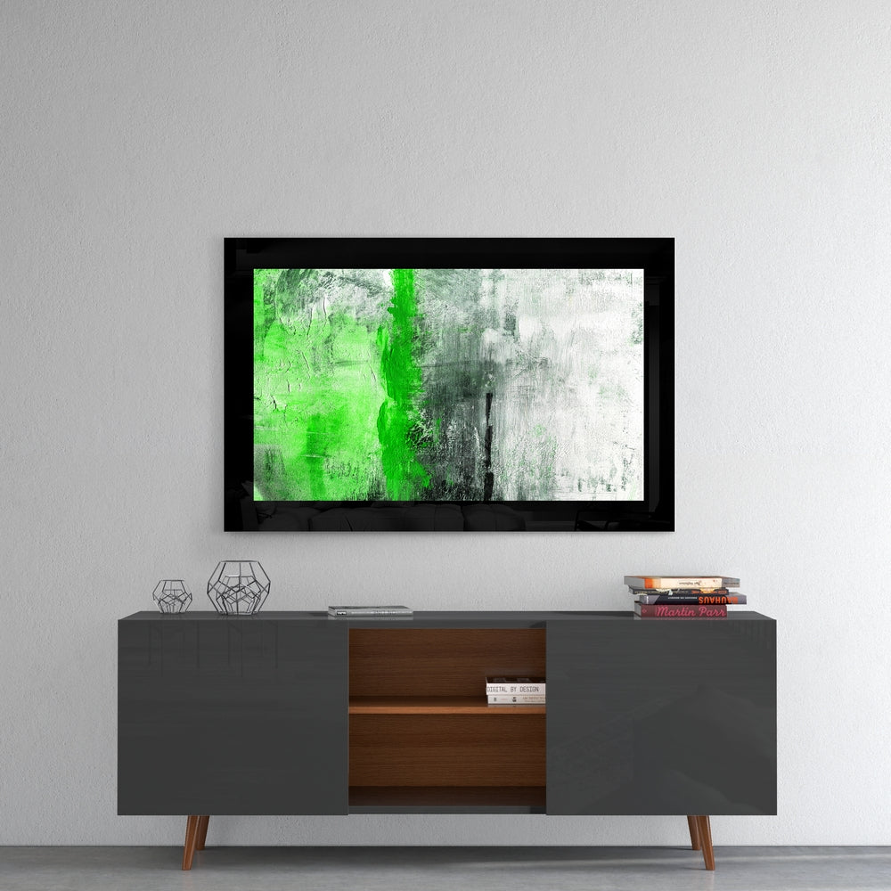Green and Green glass wall art styled above a console in a foyer