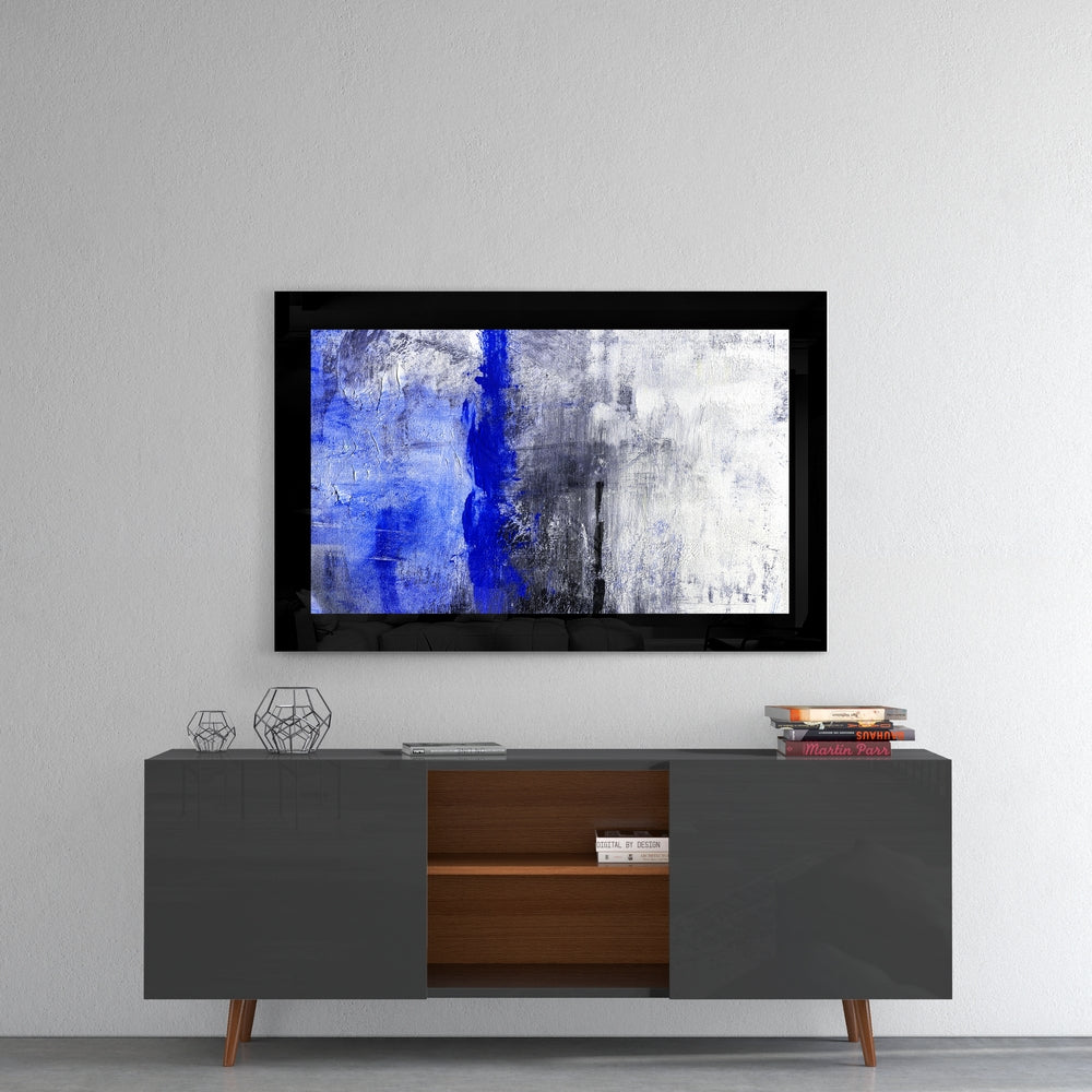 Abstract Blue glass wall art styled above a console in a foyer
