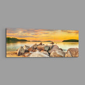 Boulder Pile Golden Sunset Bay Glass Wall Art lifestyle preview E