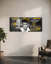 A stern crowned man in a grayscale portrait set over a black-and-gold one-hundred-dollar bill. panoramic glass wall art C