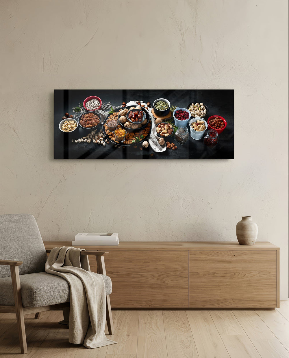 An overhead spread of mixed nuts, seeds, and dried fruit in bowls on a dark surface. panoramic glass wall art A