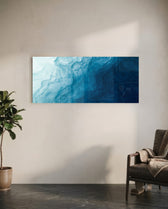 A flowing abstract that drifts from pale misty blue into deep navy like moving water. panoramic glass wall art C