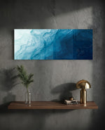 A flowing abstract that drifts from pale misty blue into deep navy like moving water. panoramic glass wall art D