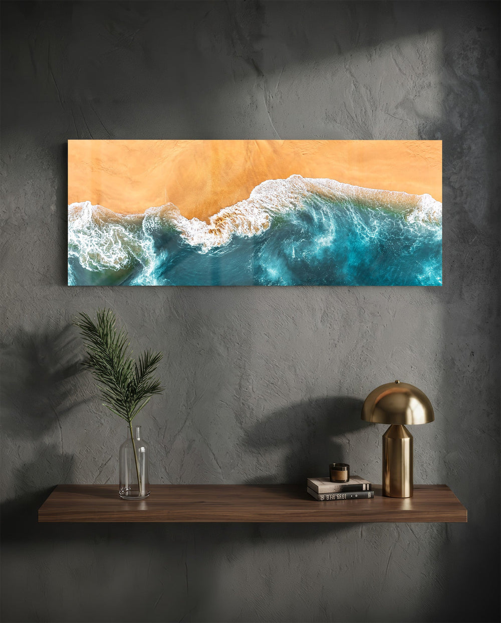 A top-down aerial view of turquoise waves rolling in white foam onto golden sand. panoramic glass wall art D